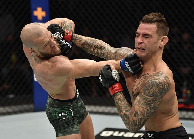 DUSTIN POIRIER punching former  former two-division Ultimate Fighting Championship titleholder Conor McGregor in UFC 257
